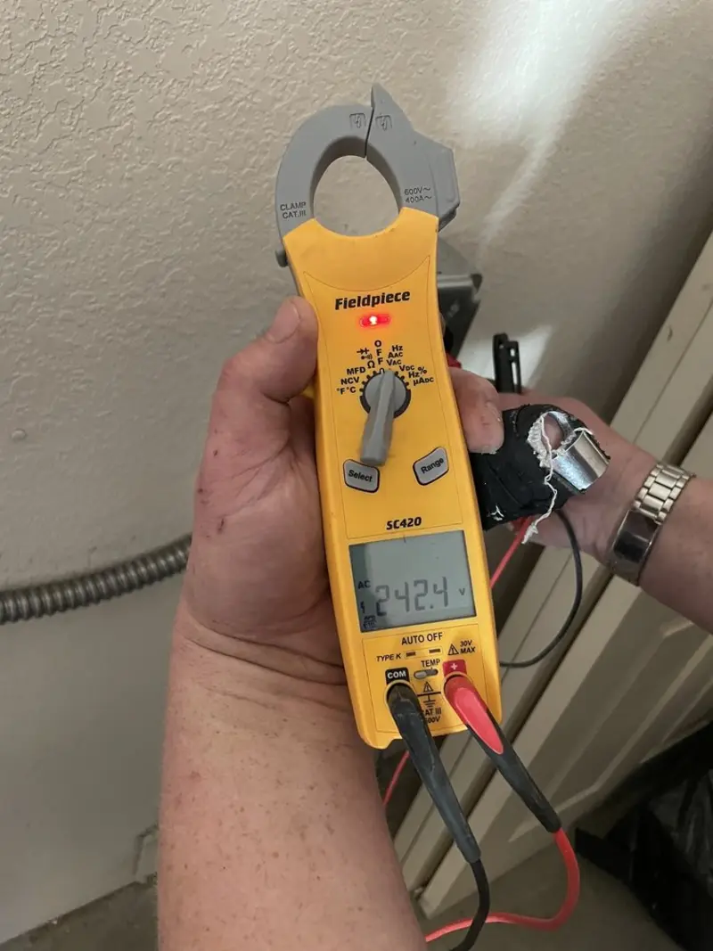 Voltage testing with clamp meter during Whole House Surge Protector in Greenwood